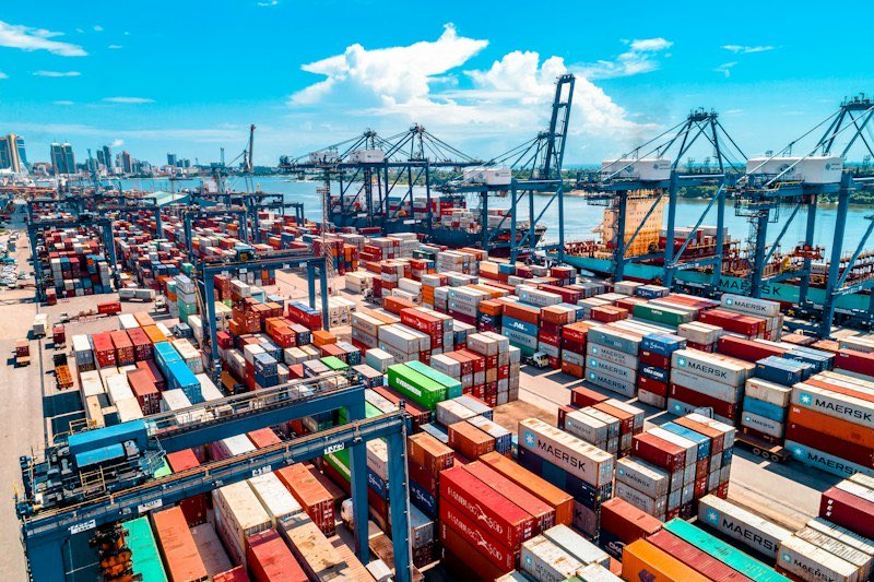 Shipping containers stacked at a container port.
